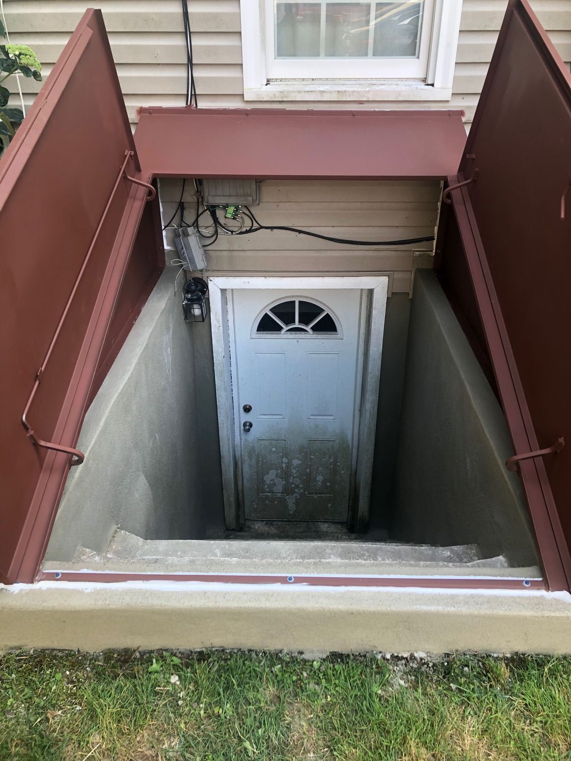 There is a door in the basement of a house.