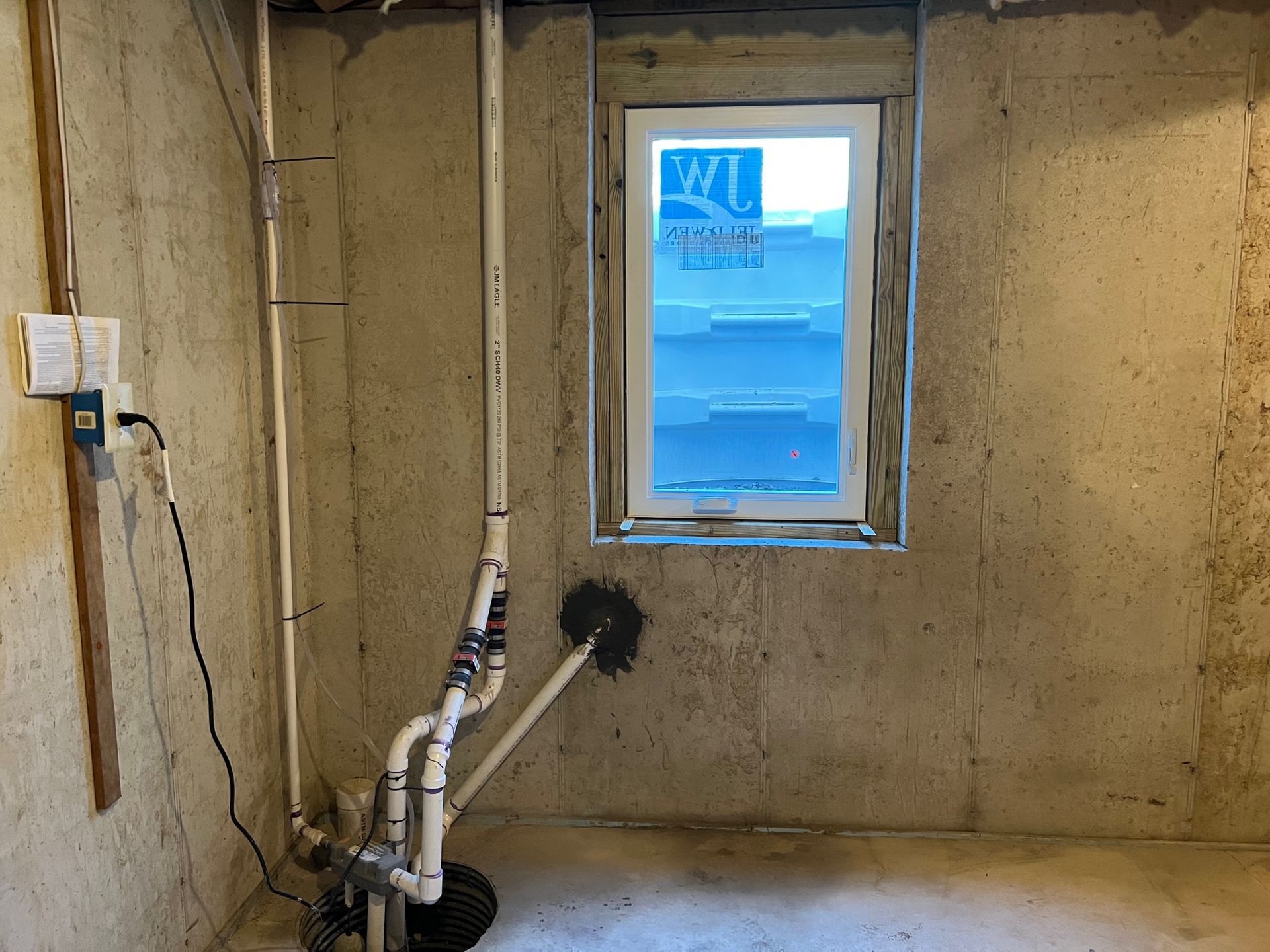 There is a window in the corner of the room.