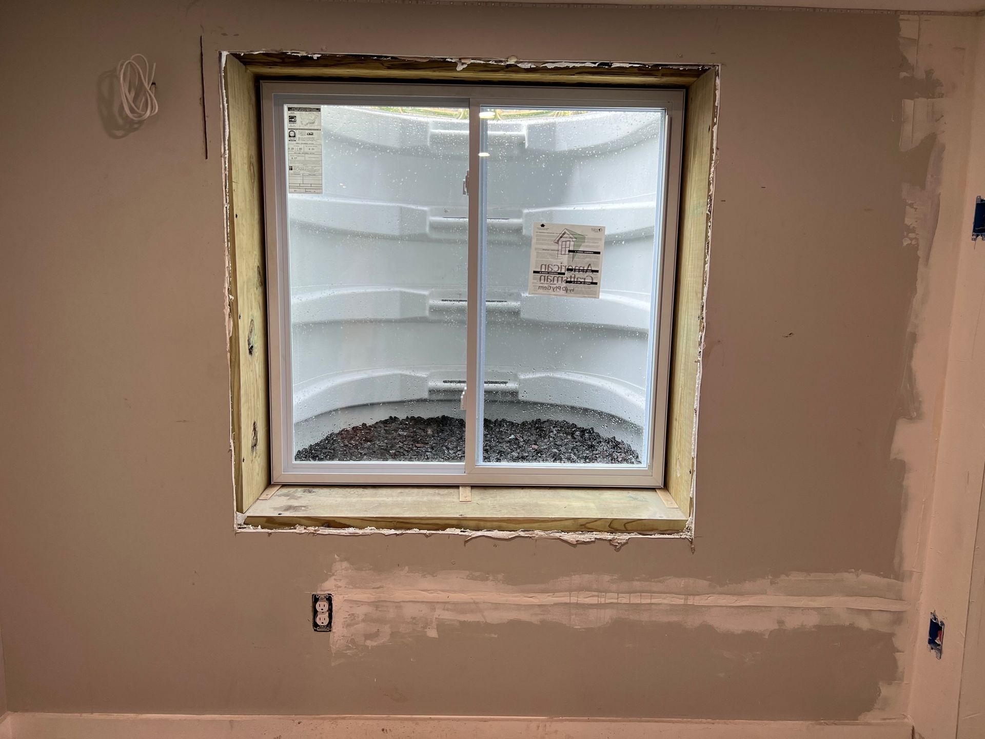 A window in a room that looks like a refrigerator.