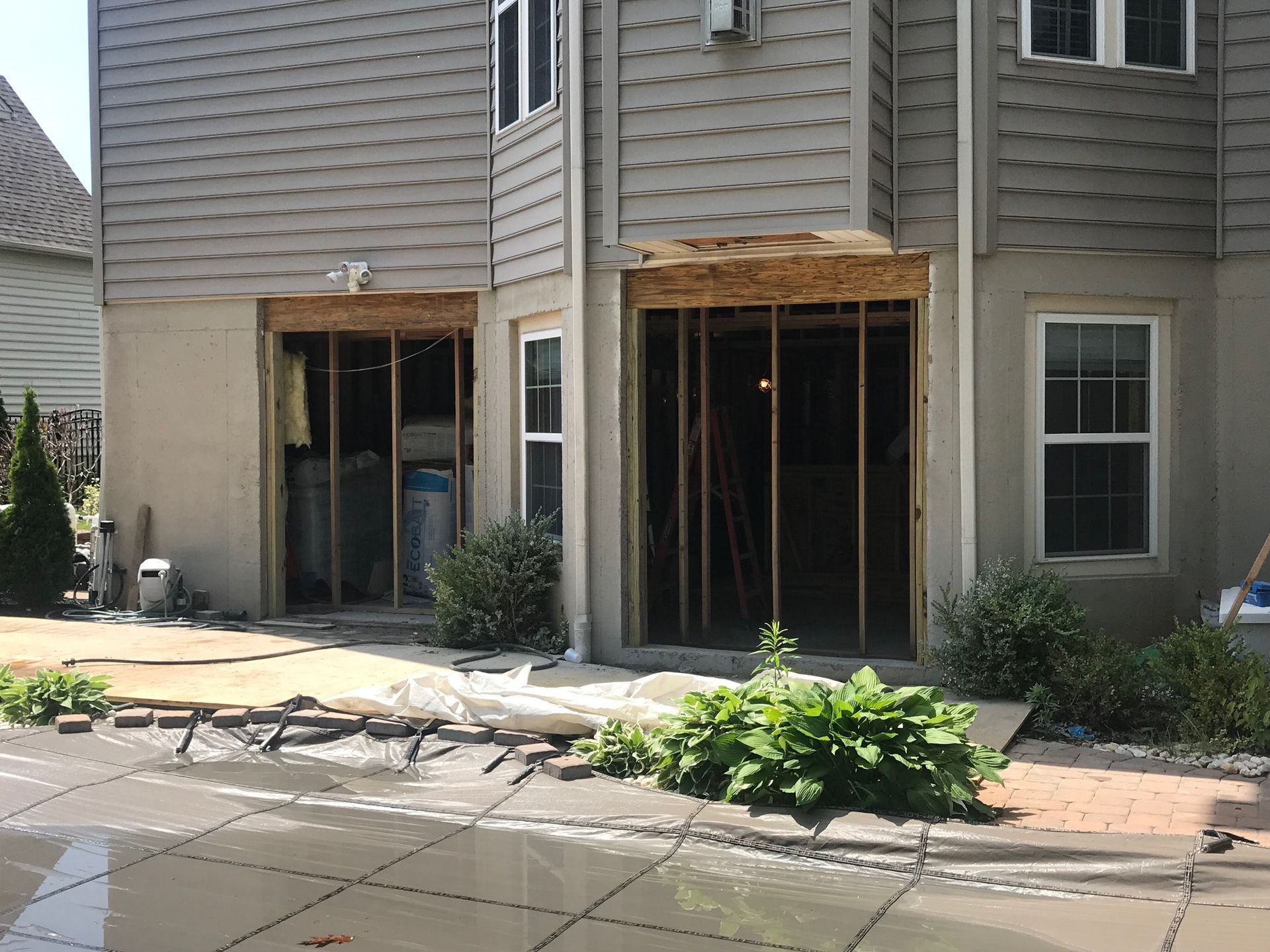 A house with a sliding glass door is being remodeled