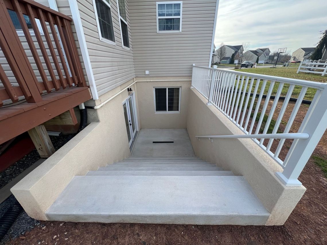 A staircase leading up to a basement of a house.