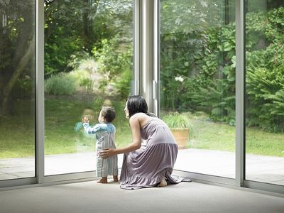 Mother and son looking out window - Glass Services in Saint Petersburg, FL