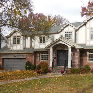 A large brick house with a gray garage door