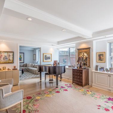 There is a piano in the middle of the living room.