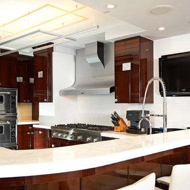 A kitchen with a stove top oven and a sink