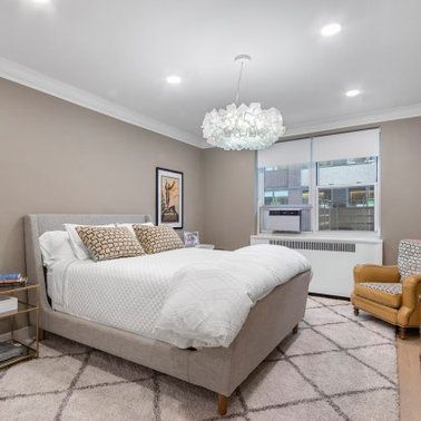 There is a large bed in the middle of the room.