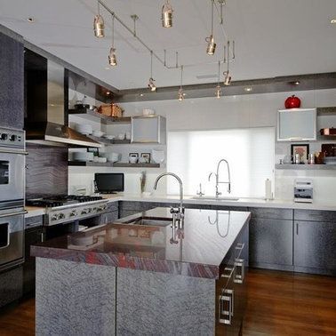 A kitchen with stainless steel appliances and granite counter tops