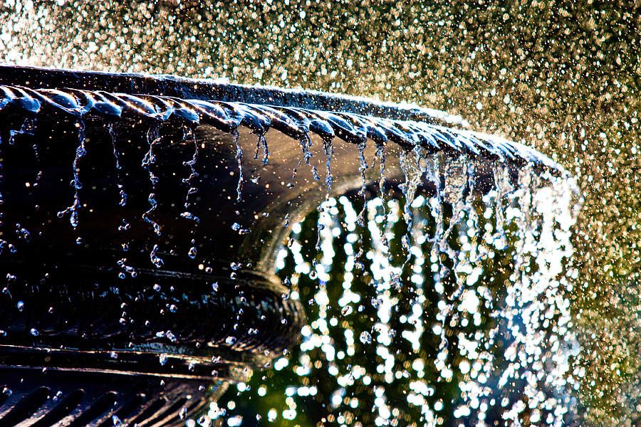 A close up of a fountain with water coming out of it.