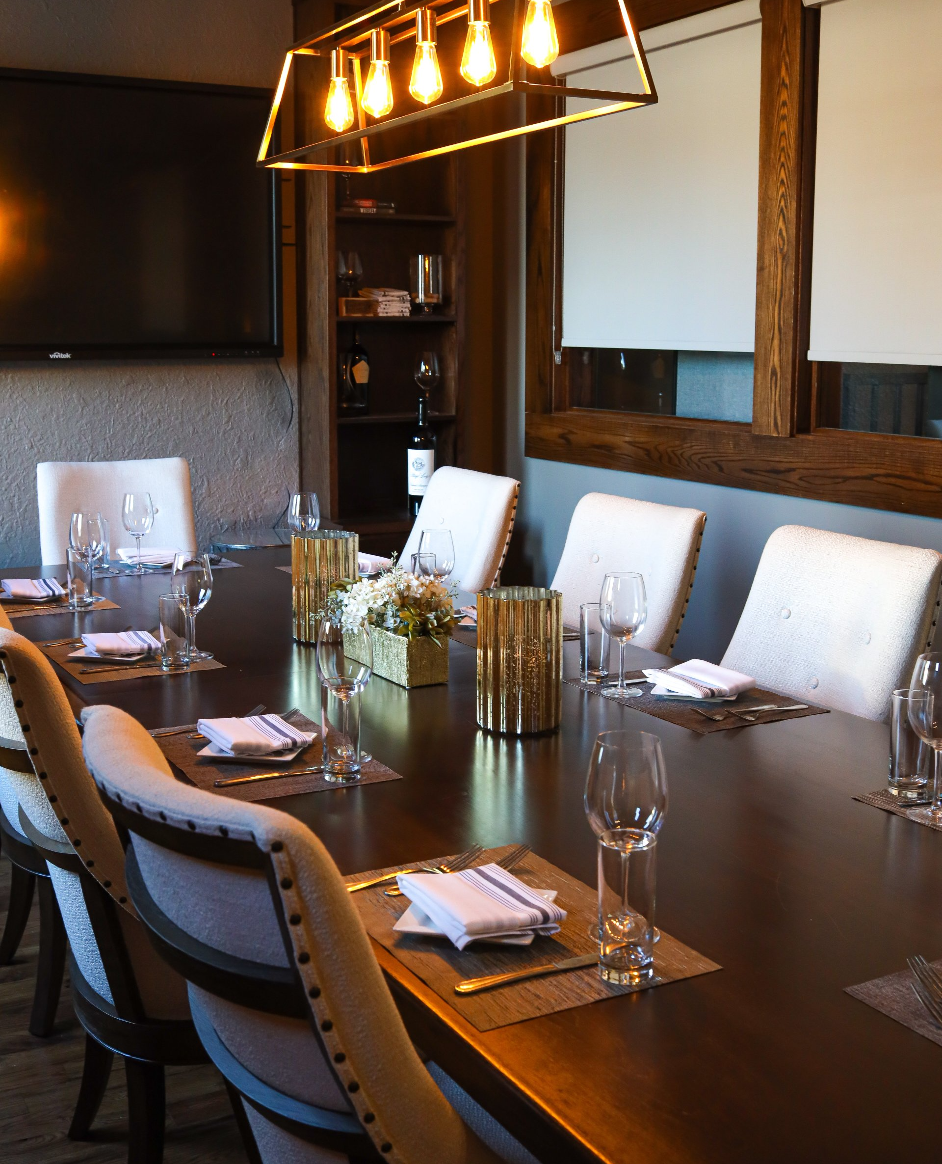 A long table with a lot of glasses on it