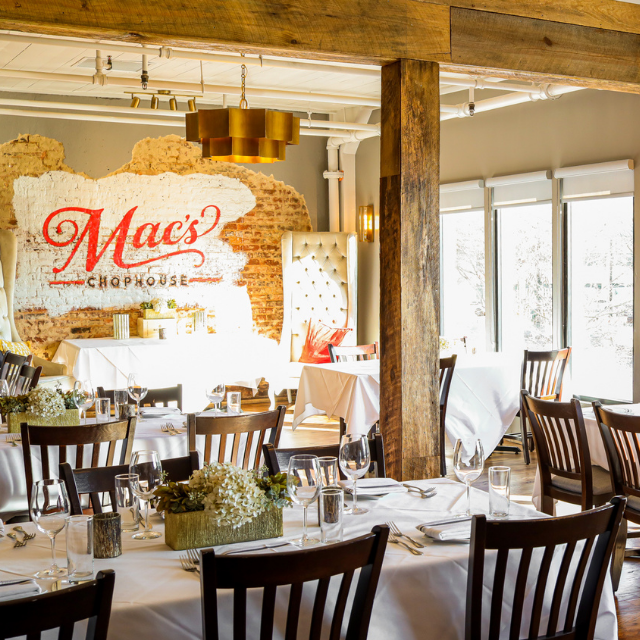 A restaurant called mac 's chophouse with tables and chairs
