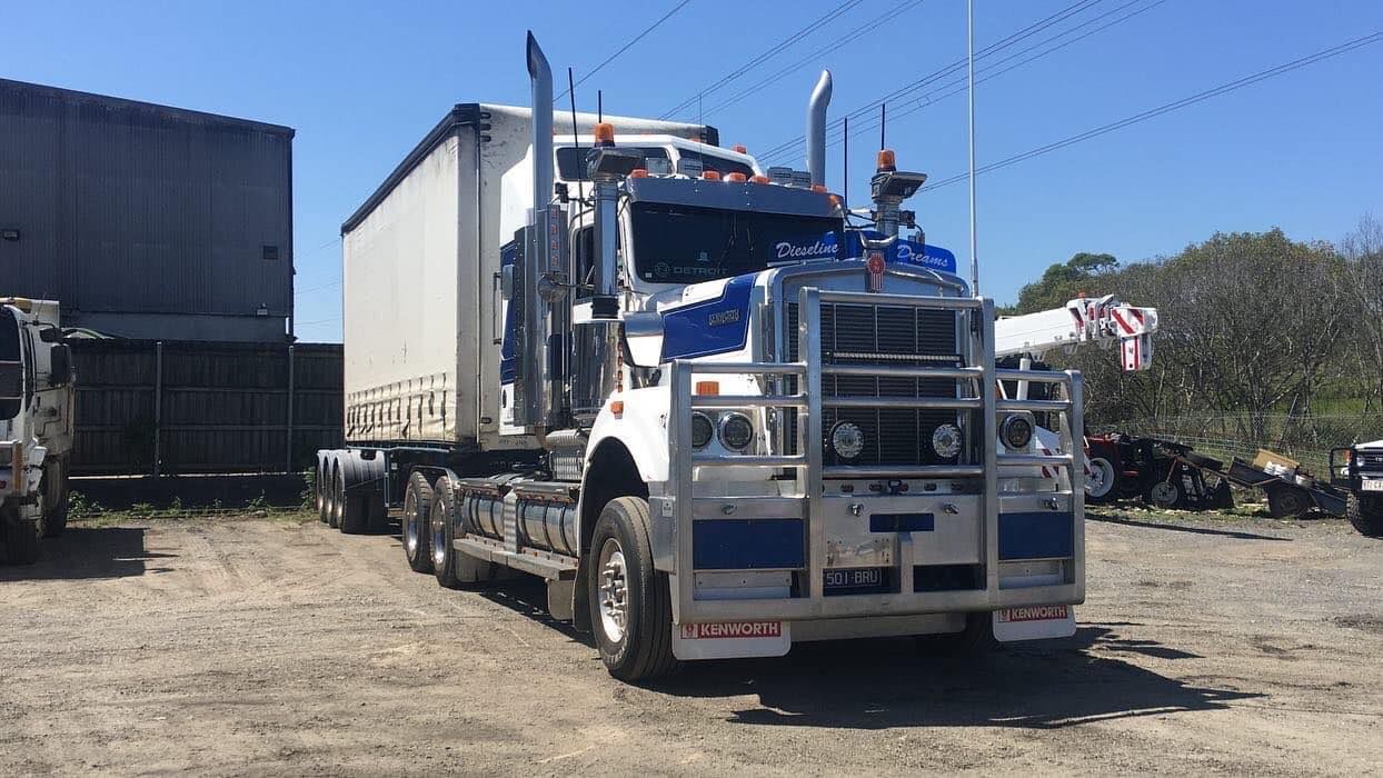 White Semi-truck With a Trailer Parked Outdoors — Supertilt Brisbane In Ormeau, QLD