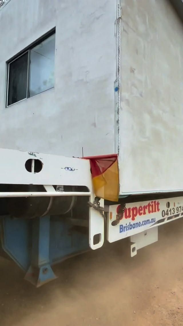 A Large, Rectangular White Structure Mounted on a Trailer Bed — Supertilt Brisbane In Bracken Ridge, QLD