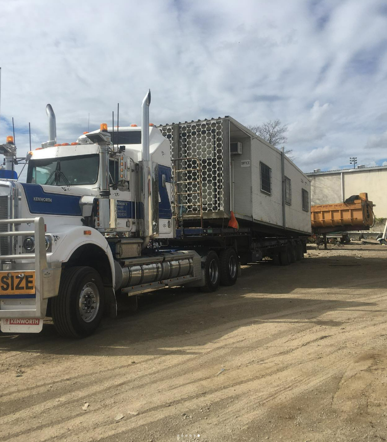 A Truck Pulling A White Small House — Supertilt Brisbane In Bracken Ridge, QLD