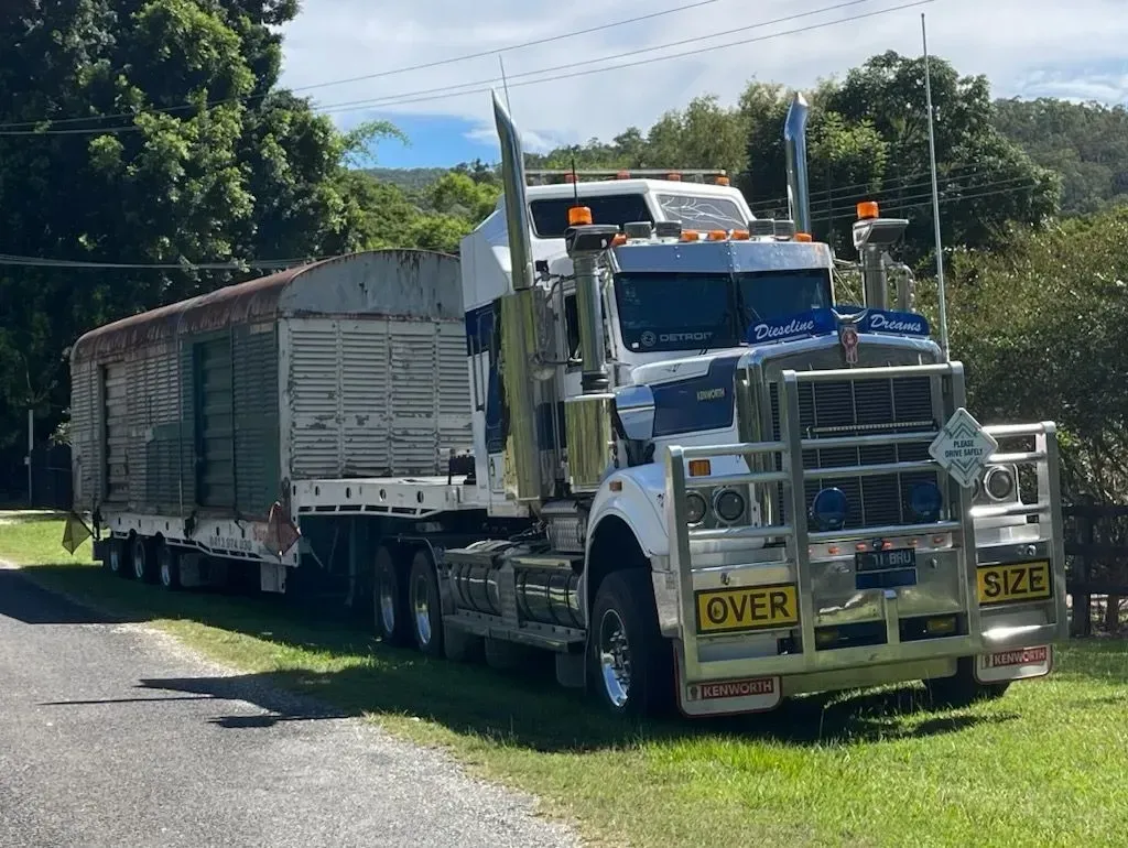White Semi-truck With Trailer on a Grassy Shoulder of a Road — Supertilt Brisbane In Bracken Ridge, QLD