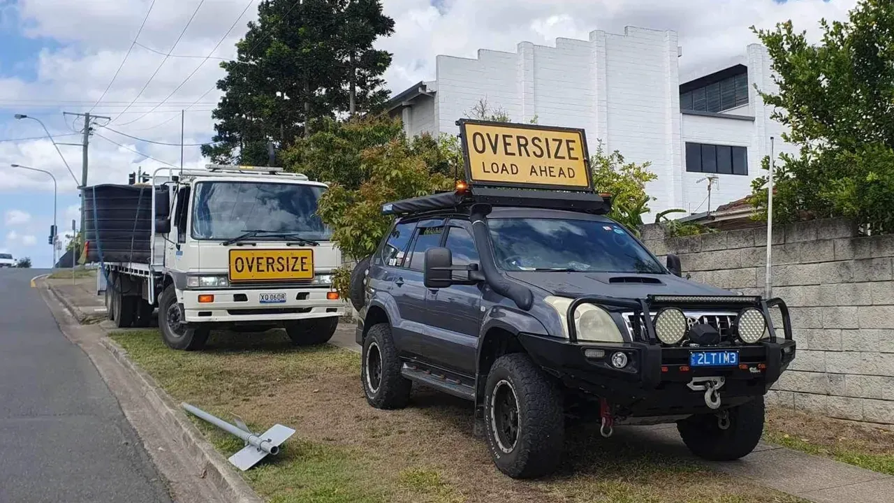 Truck and 4x4 With Oversize Load Signs Parked on Roadside — Supertilt Brisbane In Pinkenba, QLD