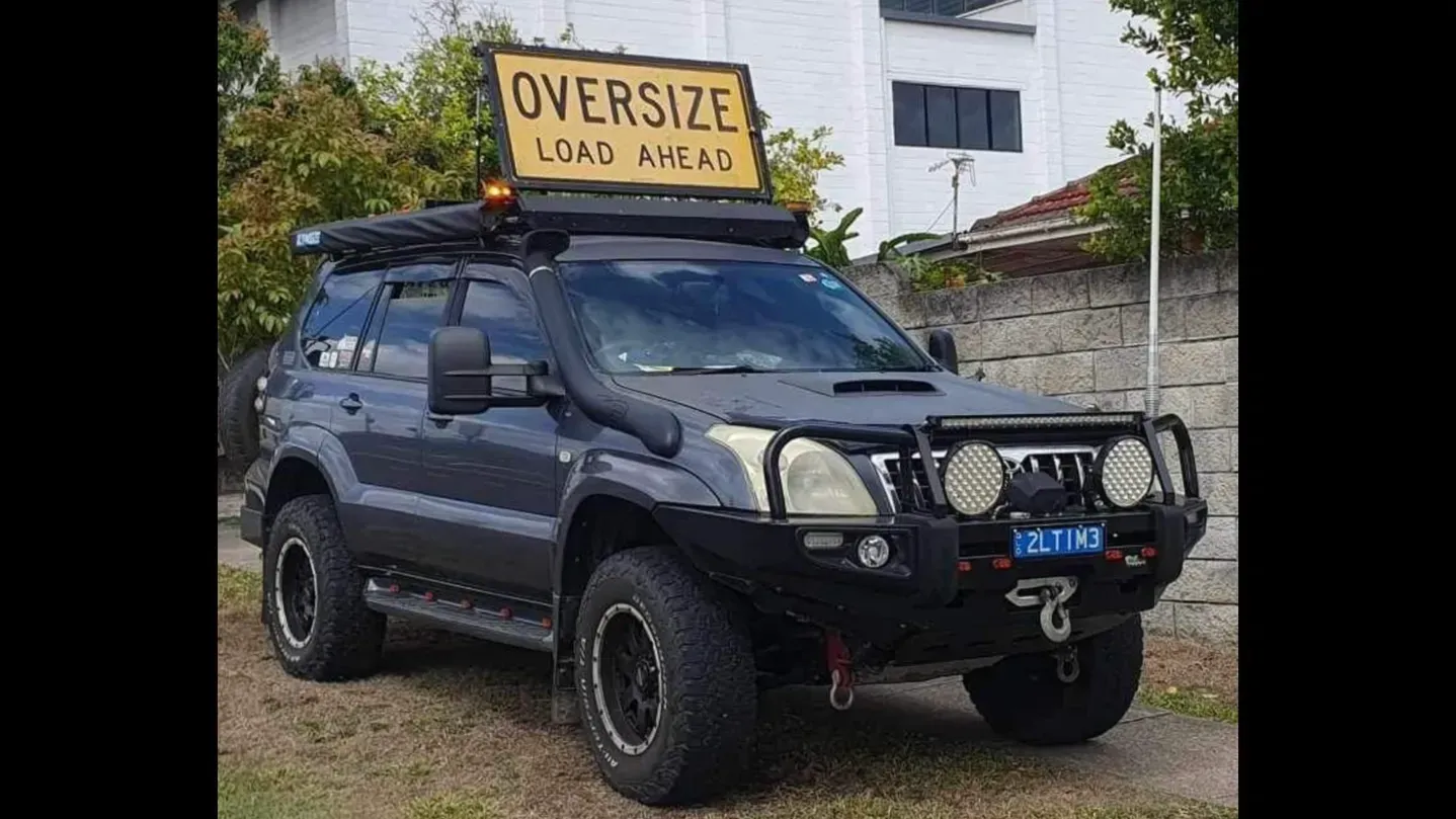 Dark Blue SUV With Oversize Load Ahead Sign on Roof — Supertilt Brisbane In Archerfield, QLD