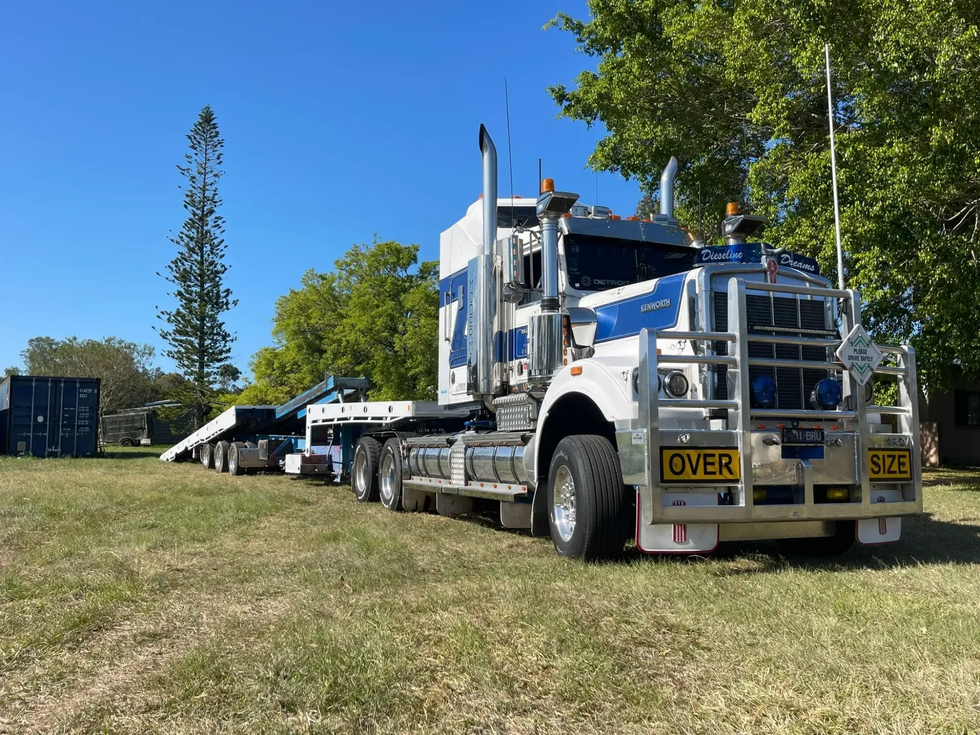Large White and Blue Semi-truck With a Flatbed Trailer — Supertilt Brisbane In Ormeau, QLD