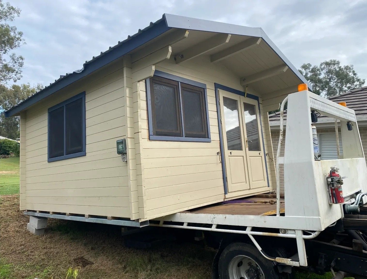 A Small, Light-colored Cabin on a Truck Bed — Supertilt Brisbane In Bracken Ridge, QLD