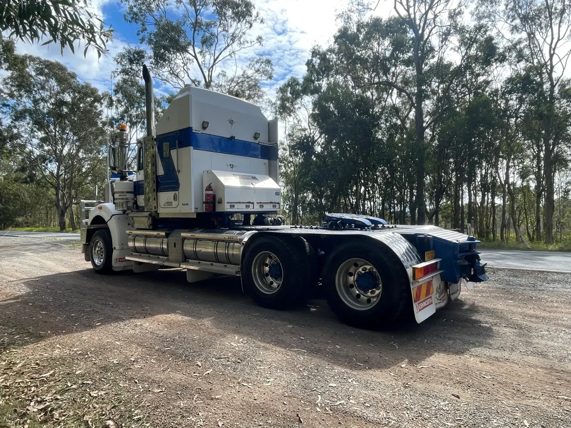 White Semi-truck on Gravel Road, Blue Stripes — Supertilt Brisbane In Bracken Ridge, QLD