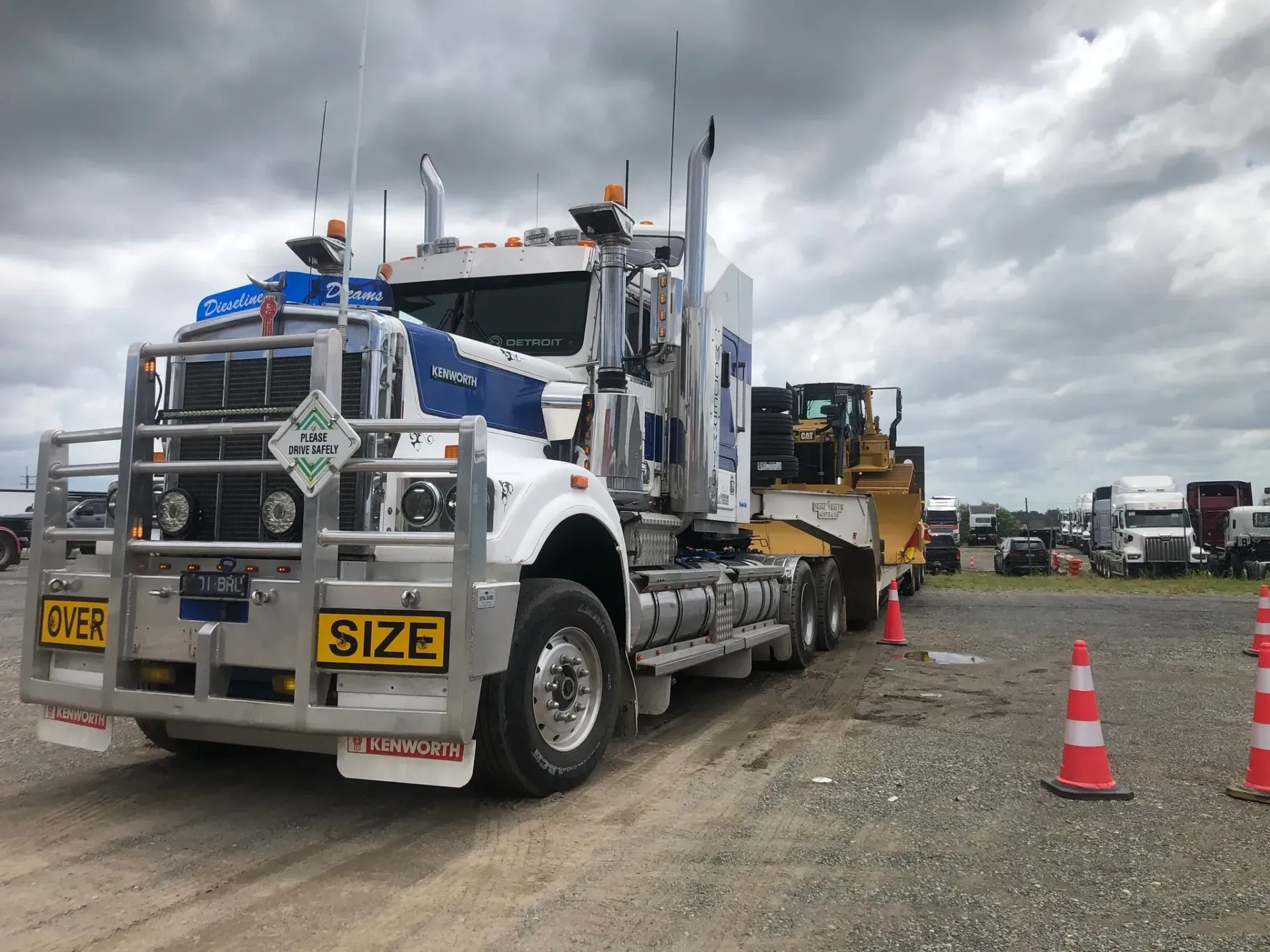 White and Blue Semi-truck With Oversized Load, Parked on Gravel — Supertilt Brisbane In Pinkenba, QLD