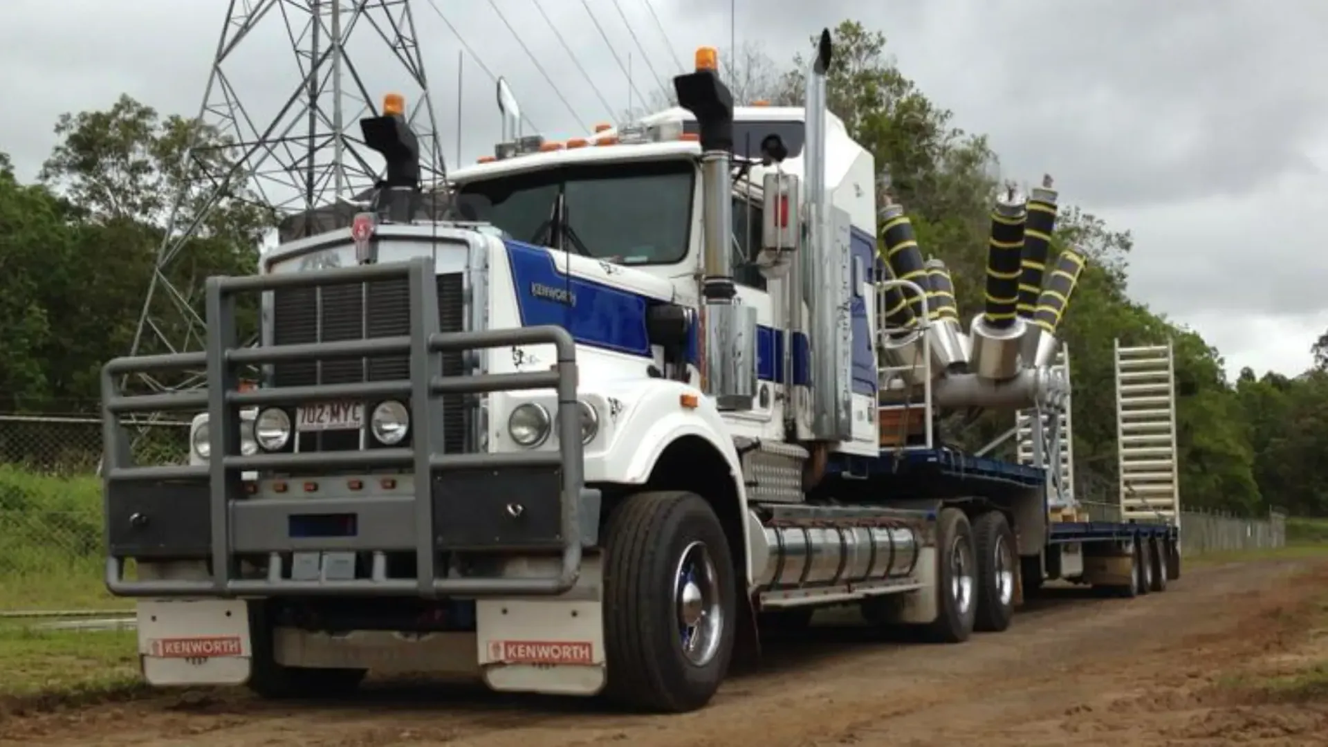 White and Blue Semi-truck With a Large Front Bumper and Load — Supertilt Brisbane In Rocklea, QLD