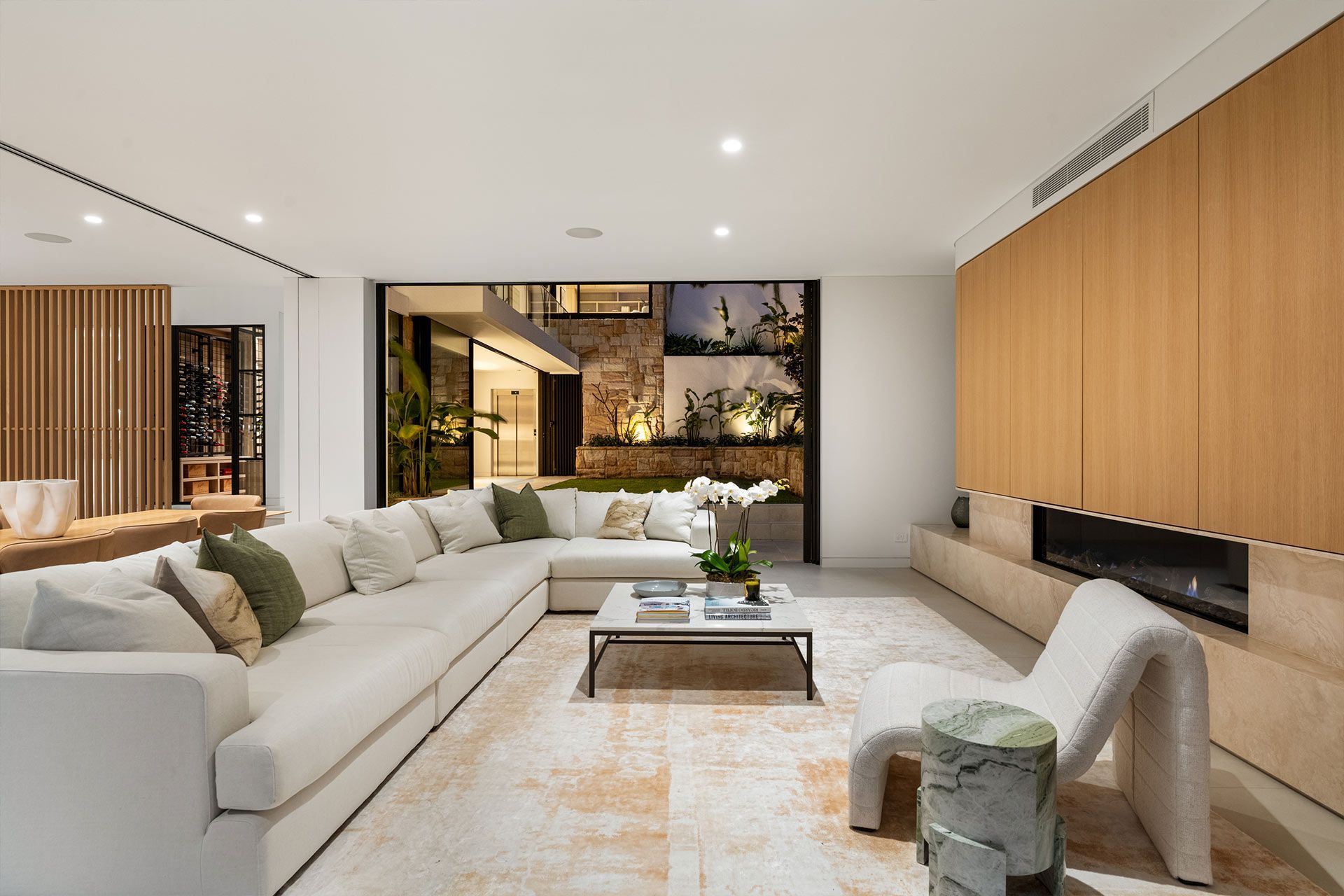 A living room with a couch , chair , coffee table and fireplace. Beauty Point.