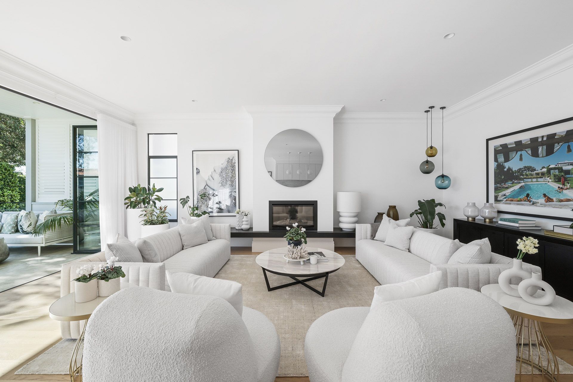 A living room filled with furniture and a fireplace. Mosman