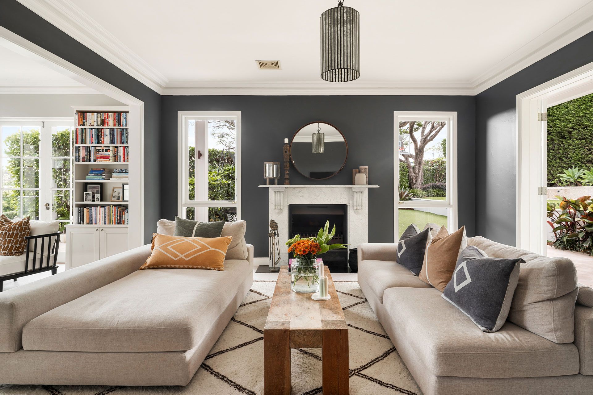 A living room with two couches and a fireplace