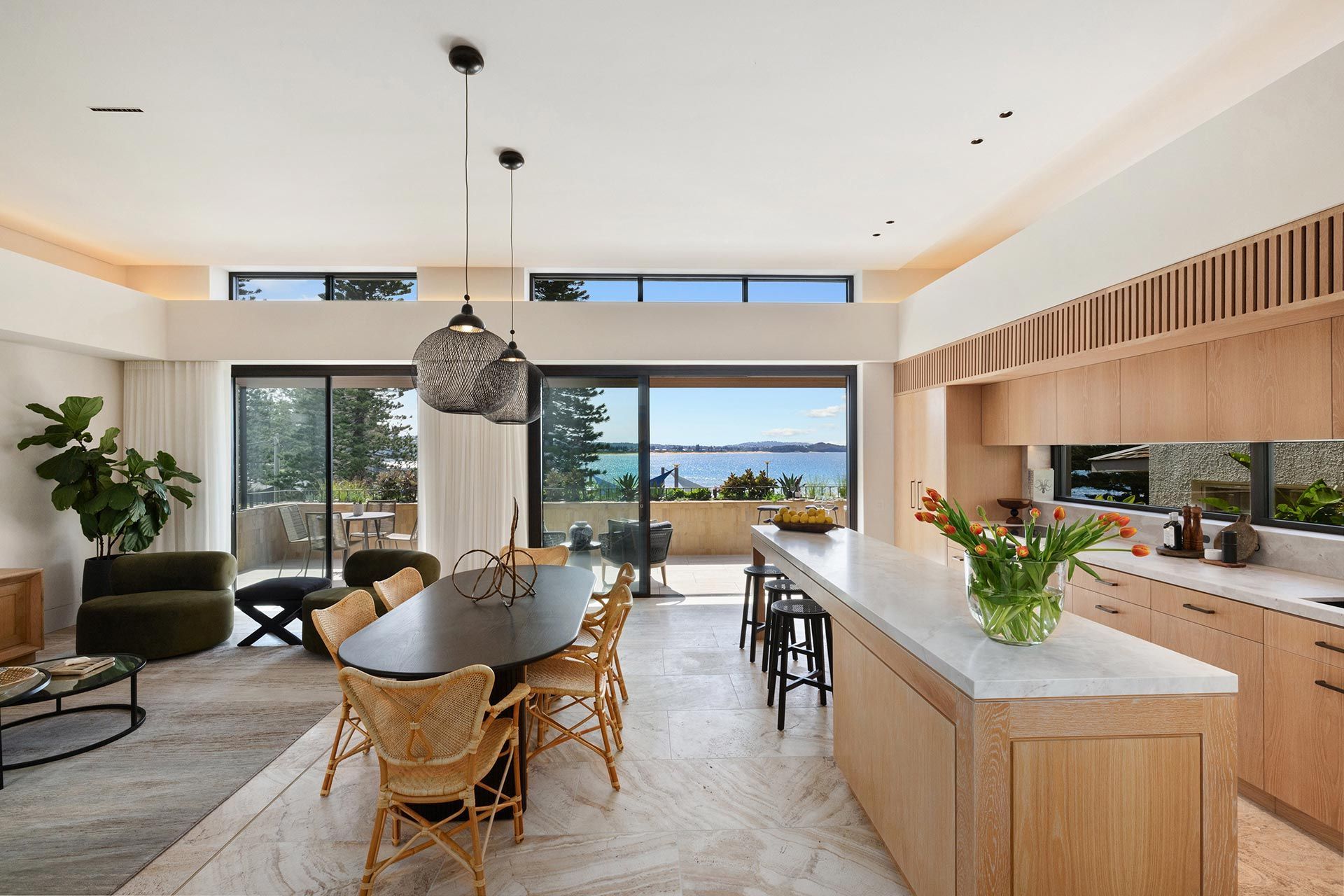 There is a large table and chairs in the middle of the room.