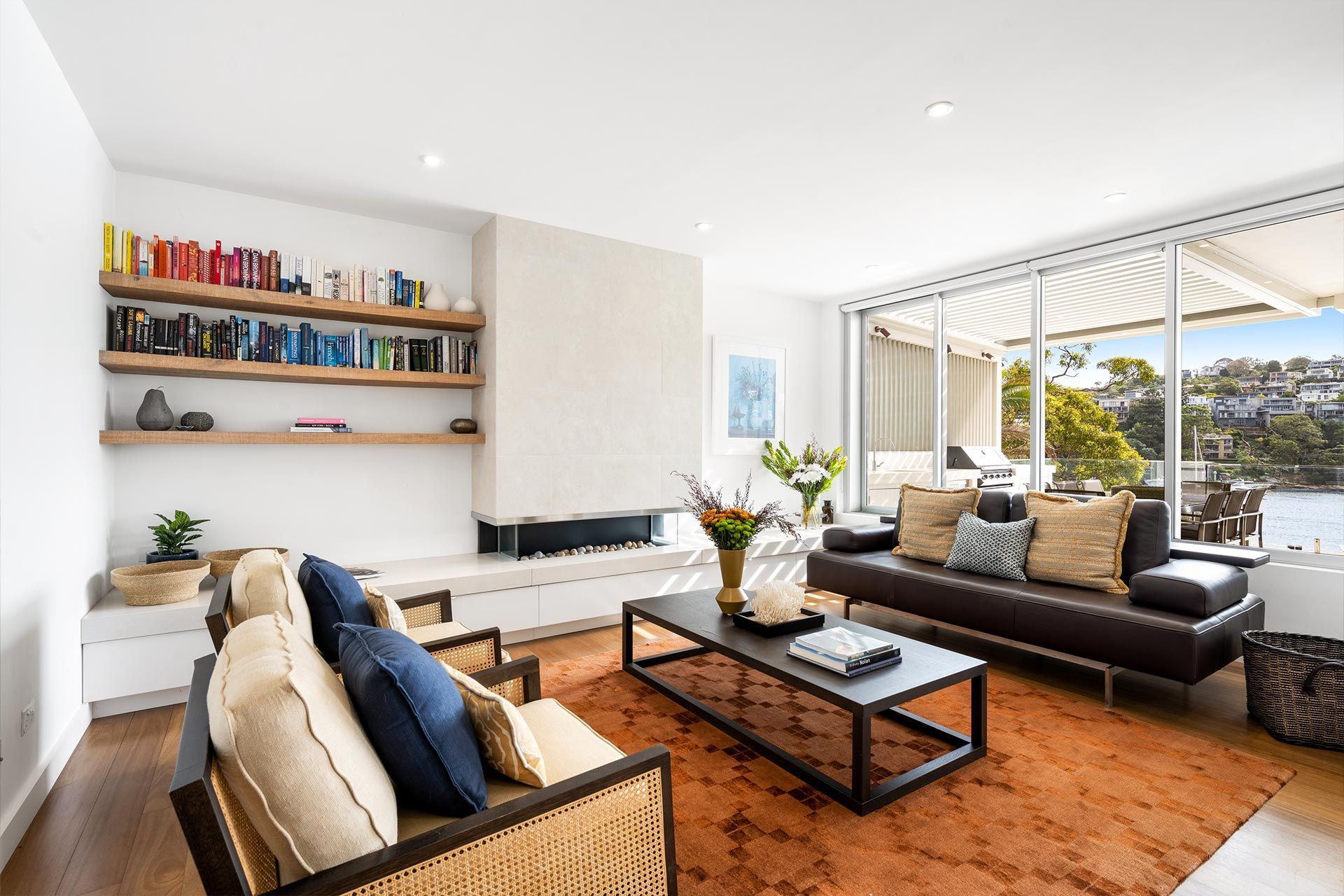 A living room with a couch , chairs and a coffee table.
