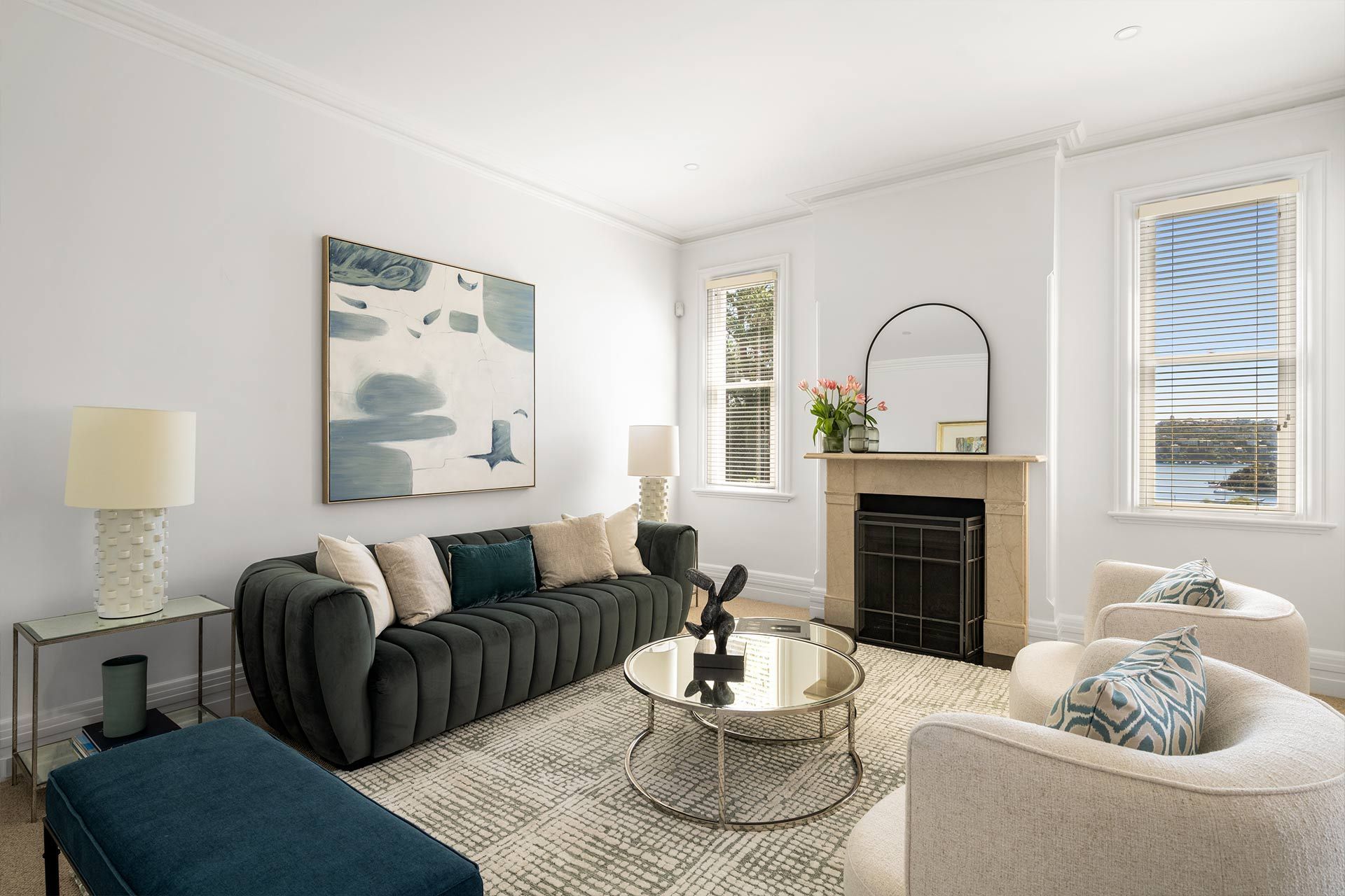 A living room with a couch , chairs , coffee table and fireplace. Beauty Point.