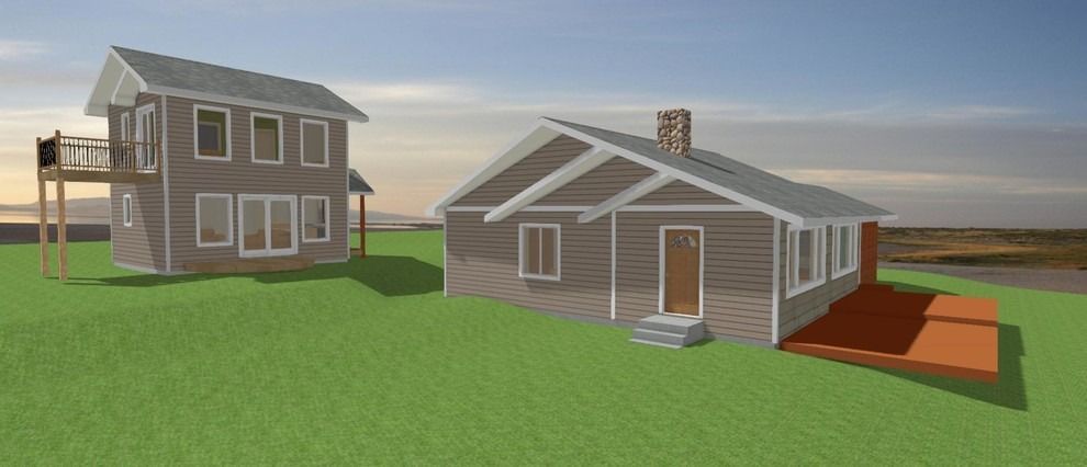 A couple of houses are sitting on top of a lush green field.