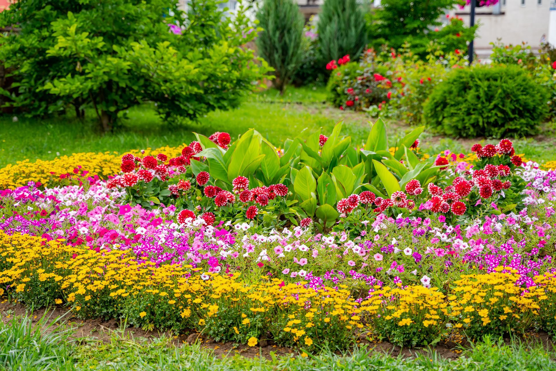 circular themed flower bed with many layers of colors