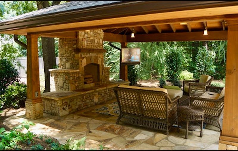 outdoor living area with patio and fireplace