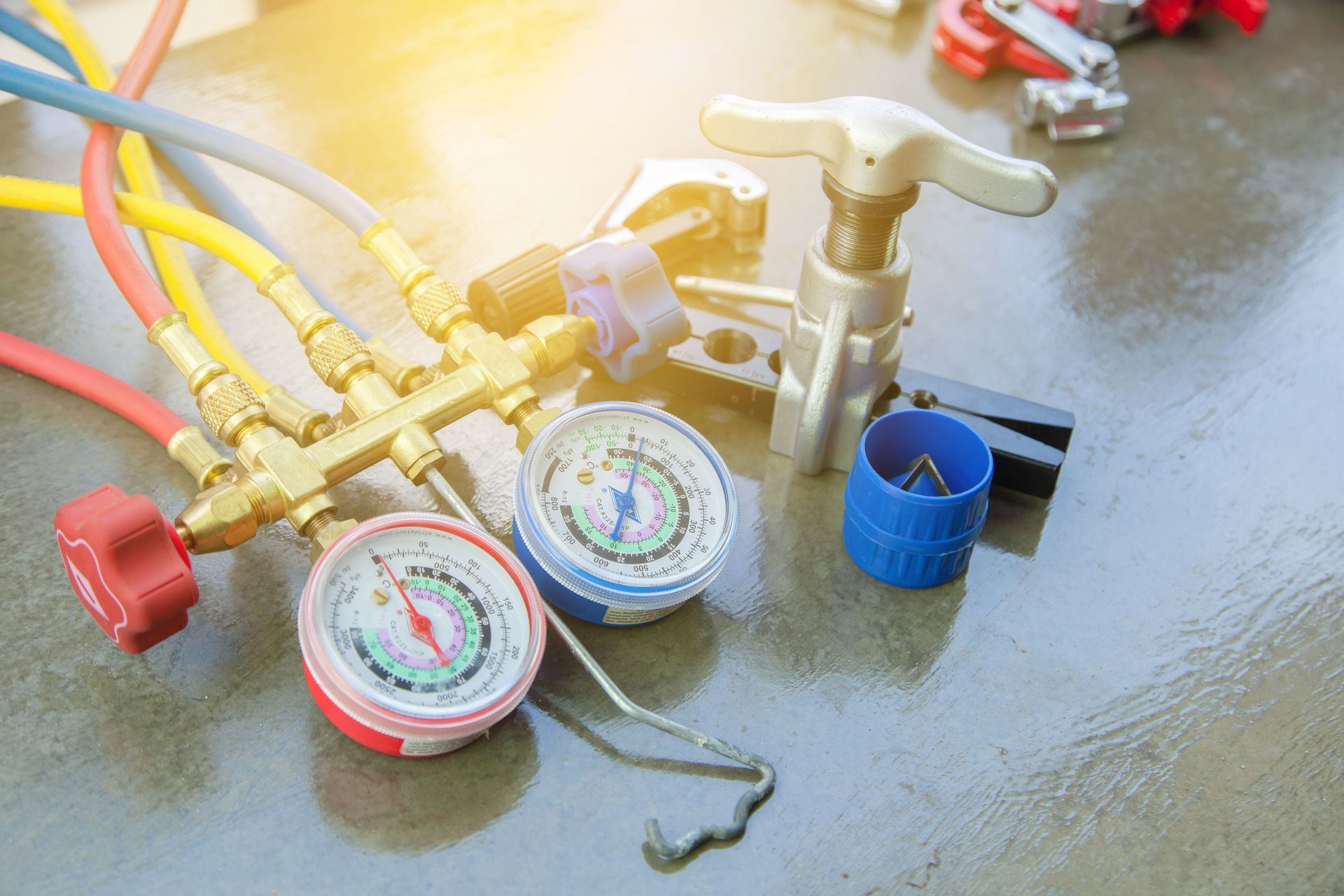 A bunch of tools and gauges are sitting on a table.