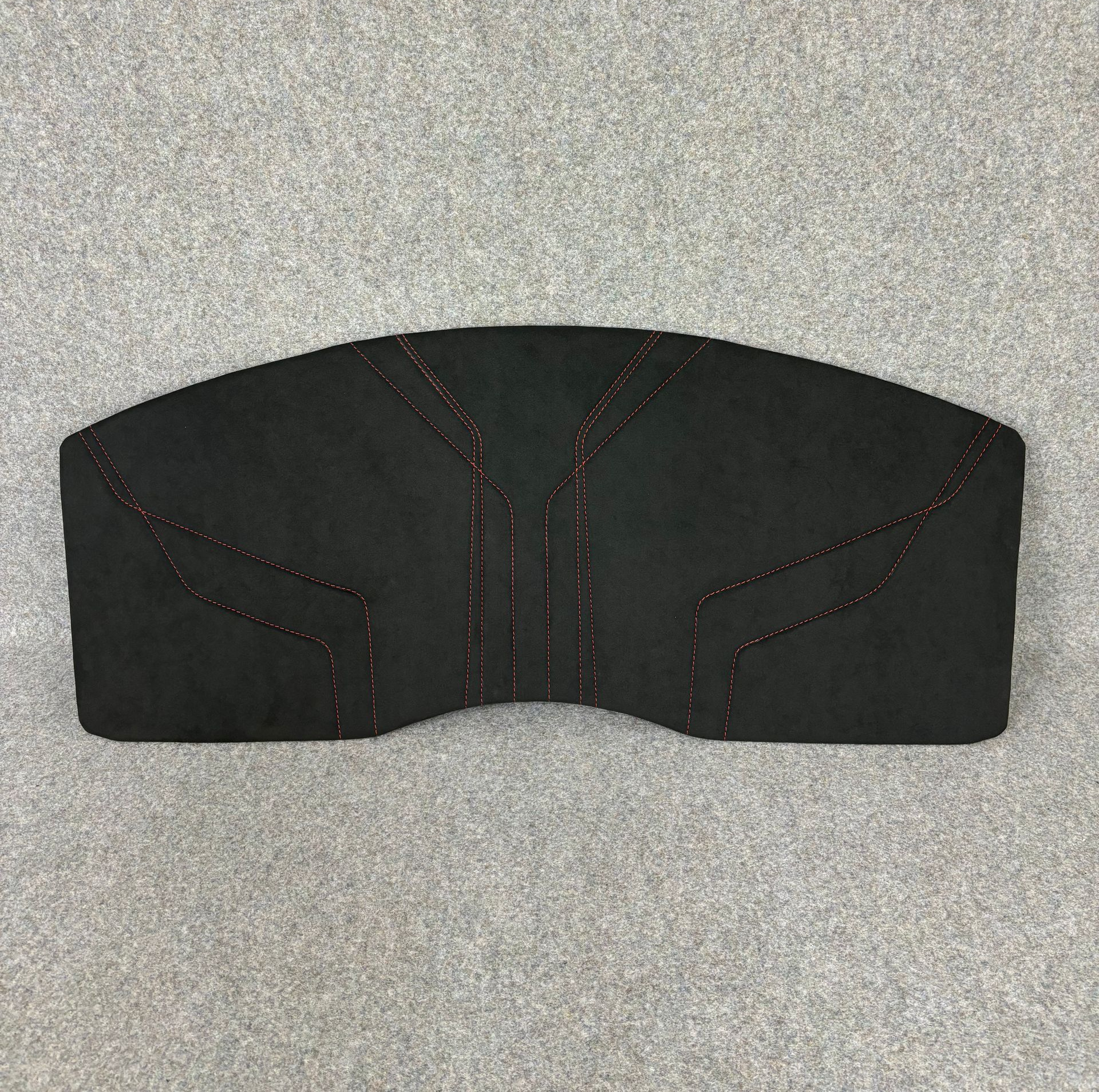 Trim panel change to grey suede with red stitching