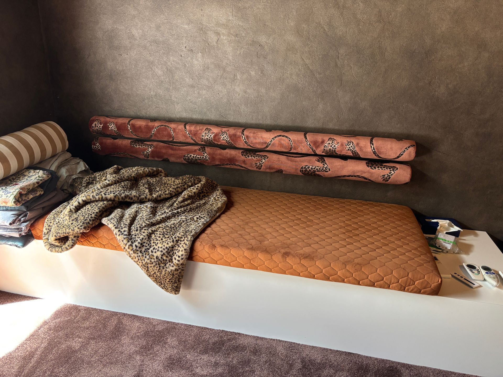 Back rest upholstered in Catherine Martin x Mokum Panthera fabric and cushion in Warwick Essence Quilted copper