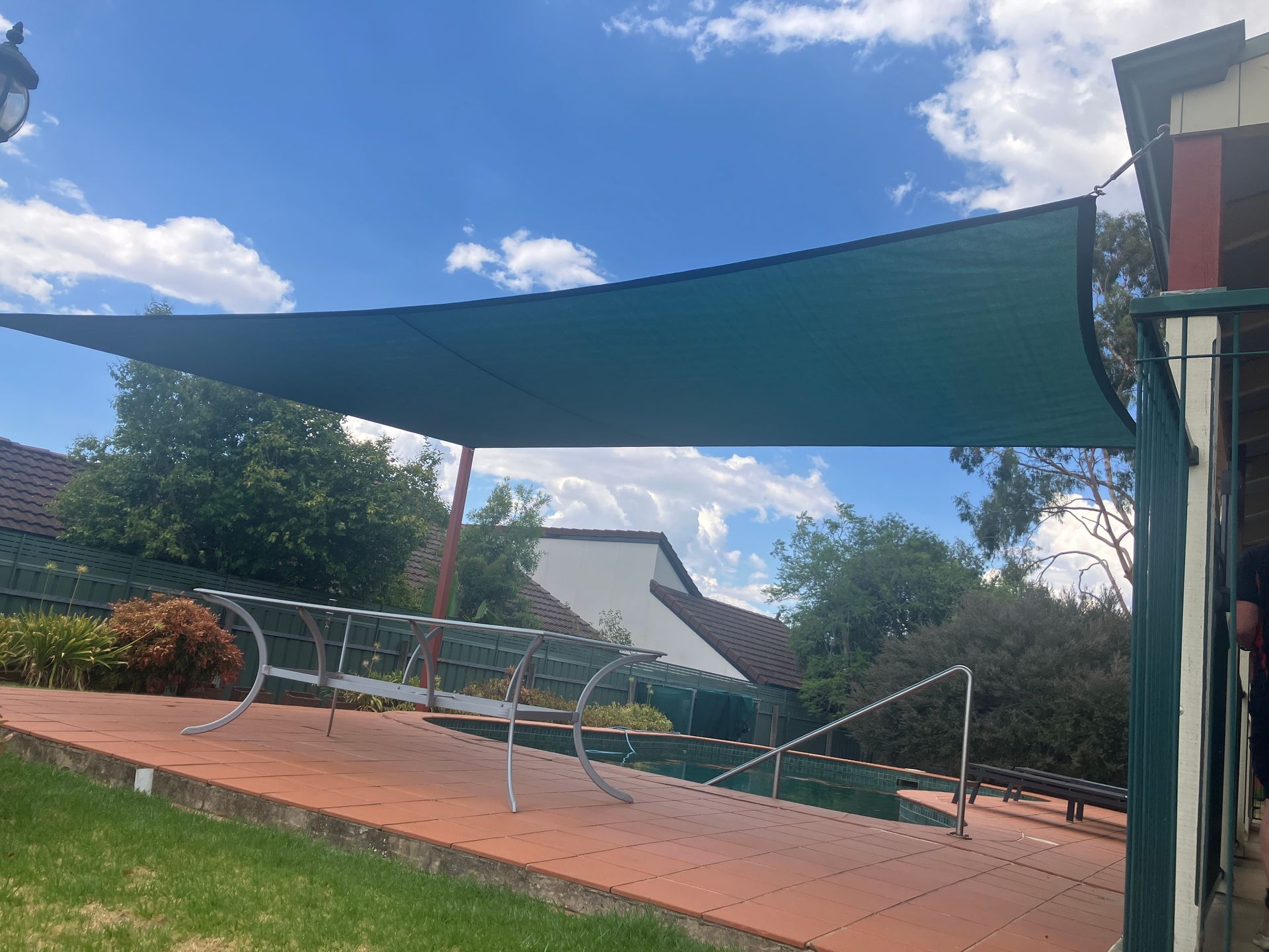 Shade sail in dark green