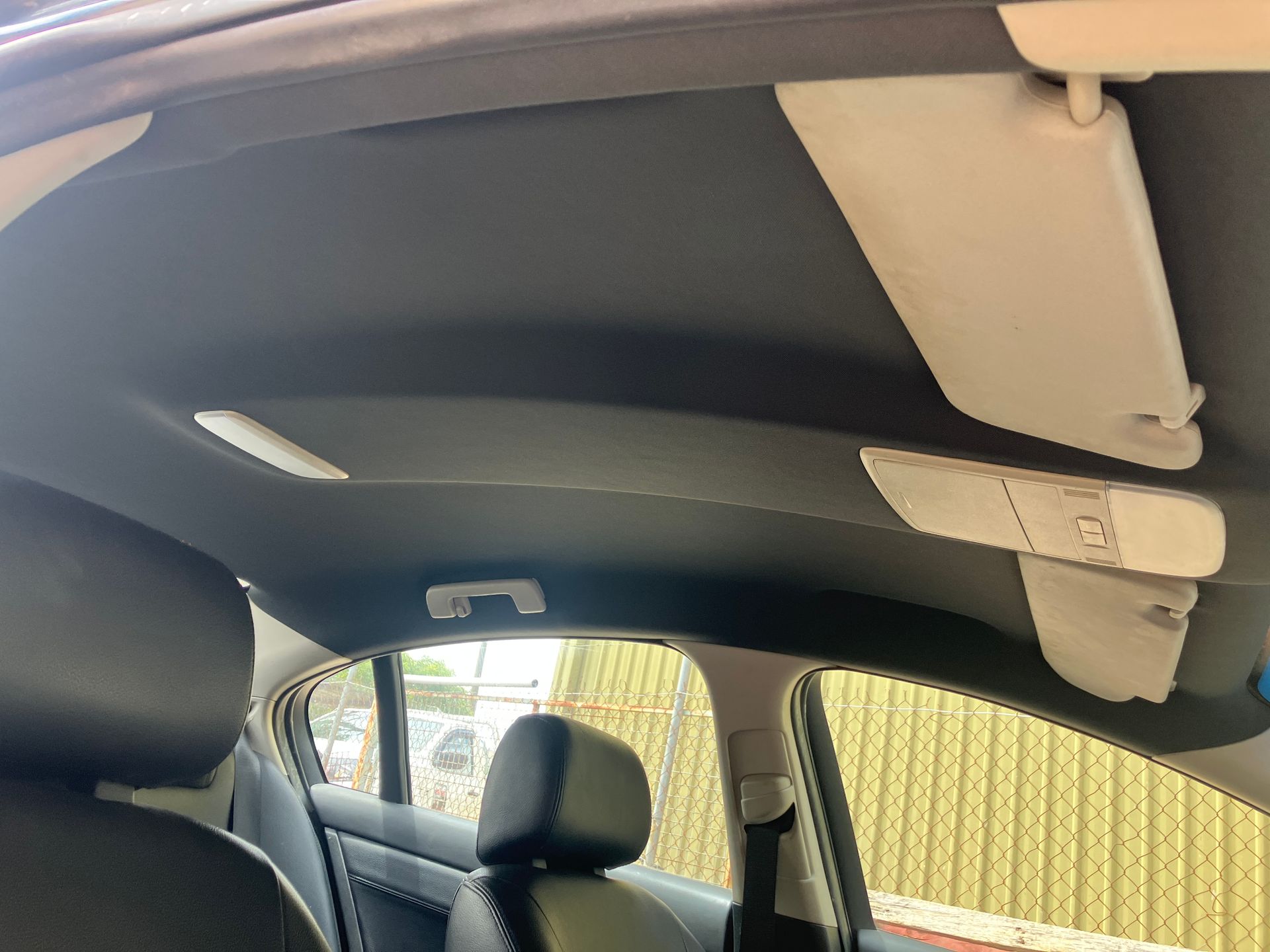 VE sedan headlining recover in black circular knit fabric