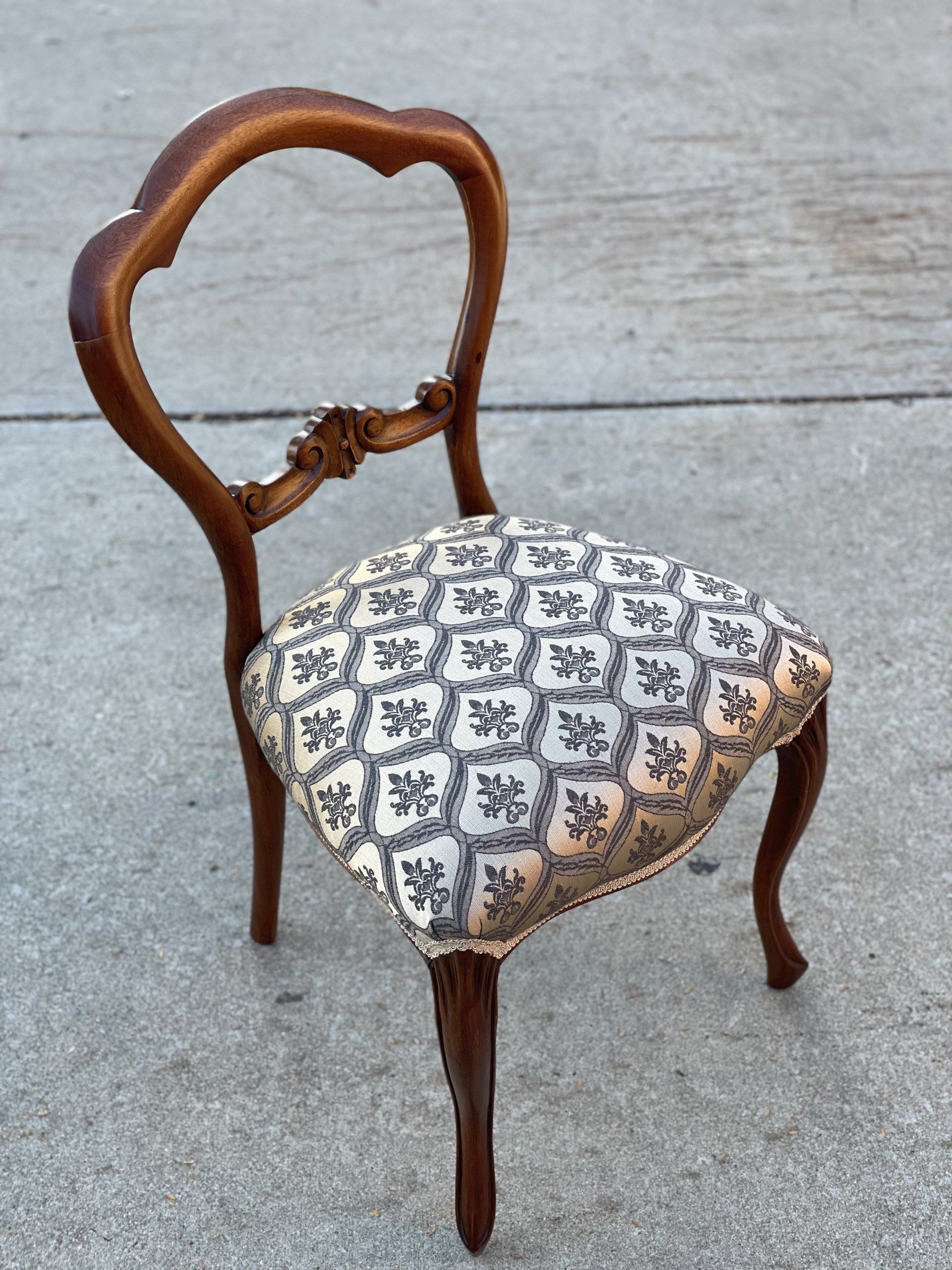 Balloon back antique dining chair with gold tapestry cover
