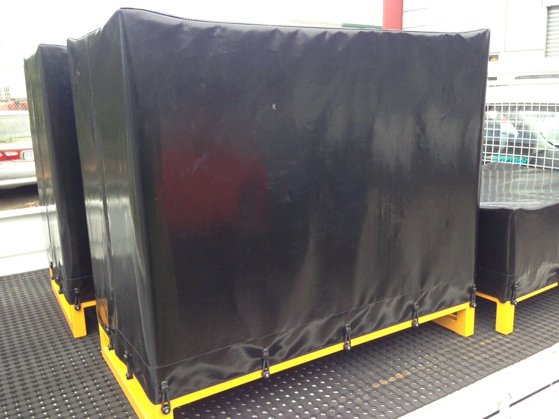 Black PVC covers on crates