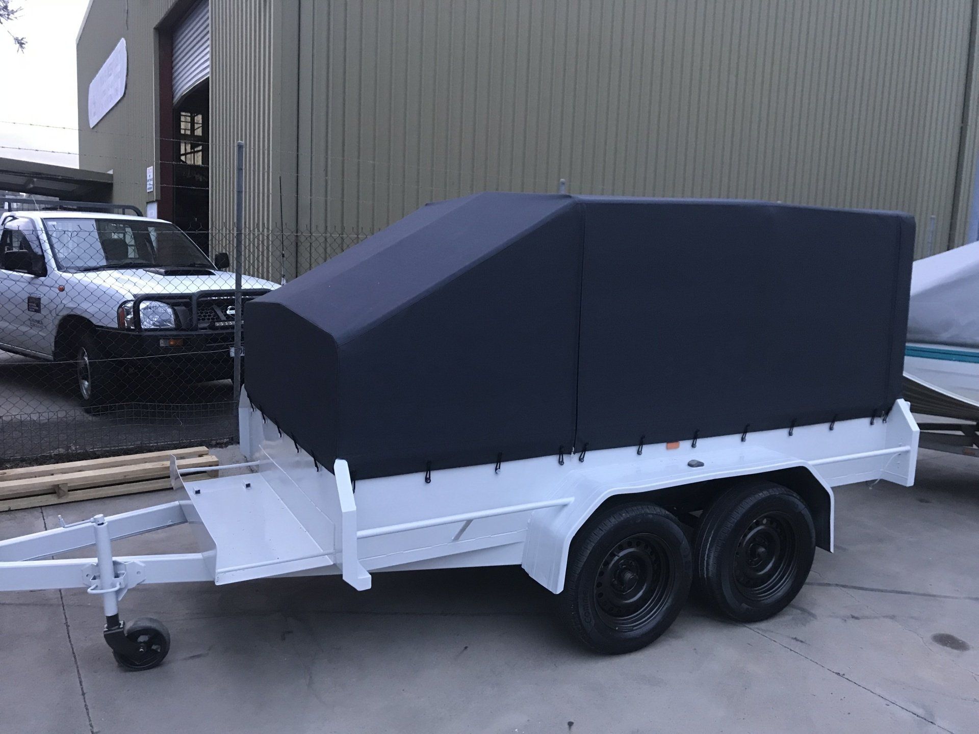 Black cover on tapered trailer frame