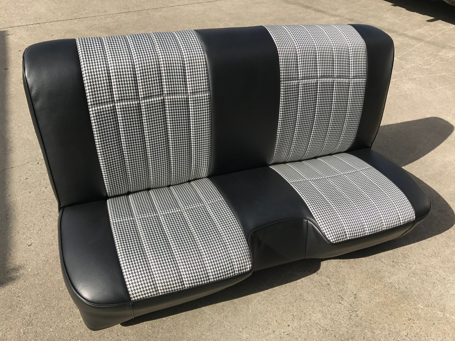 Black bench seat with houndstooth cloth inserts front
