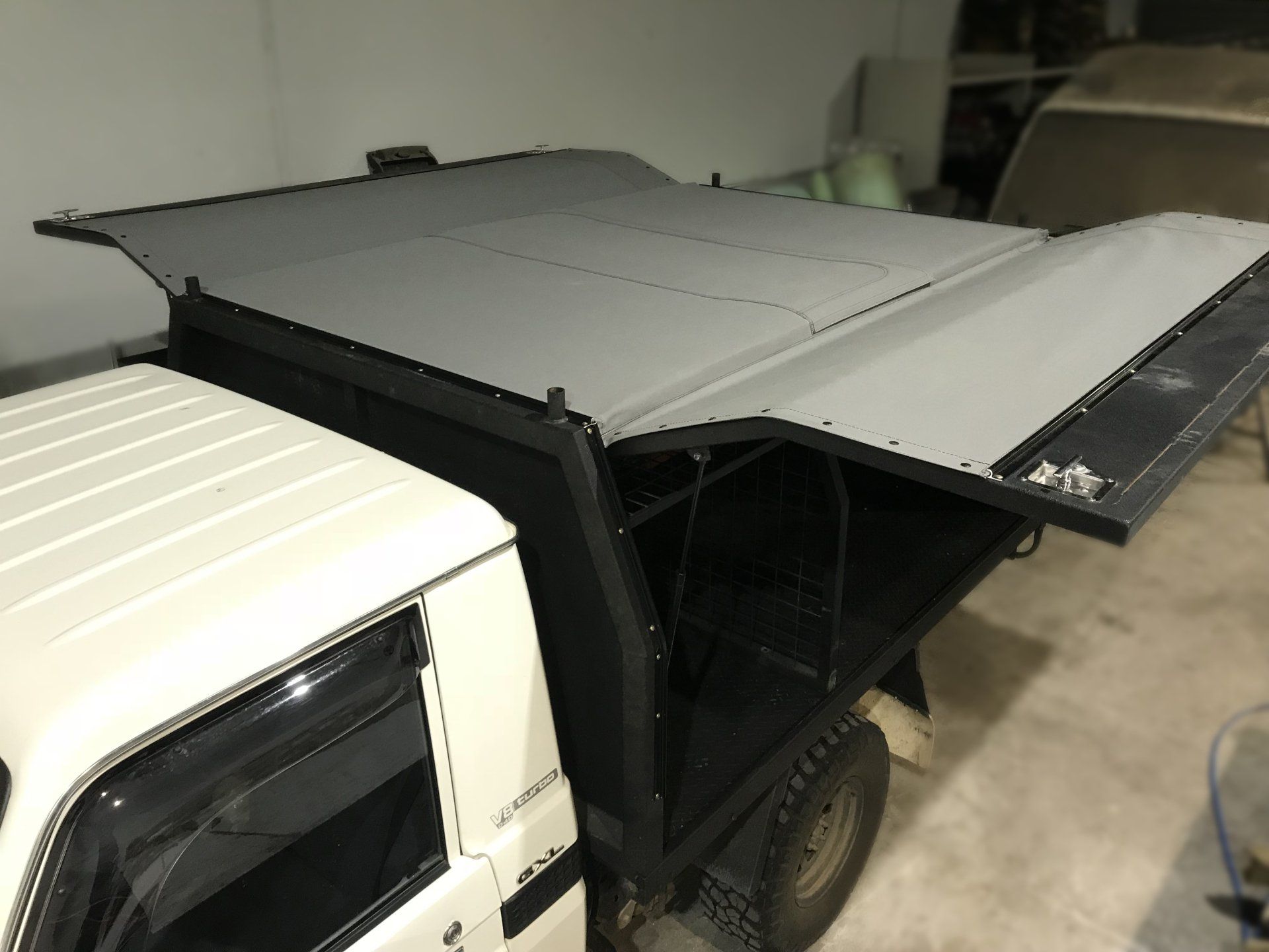 Canvas canopy attached to steel frame open