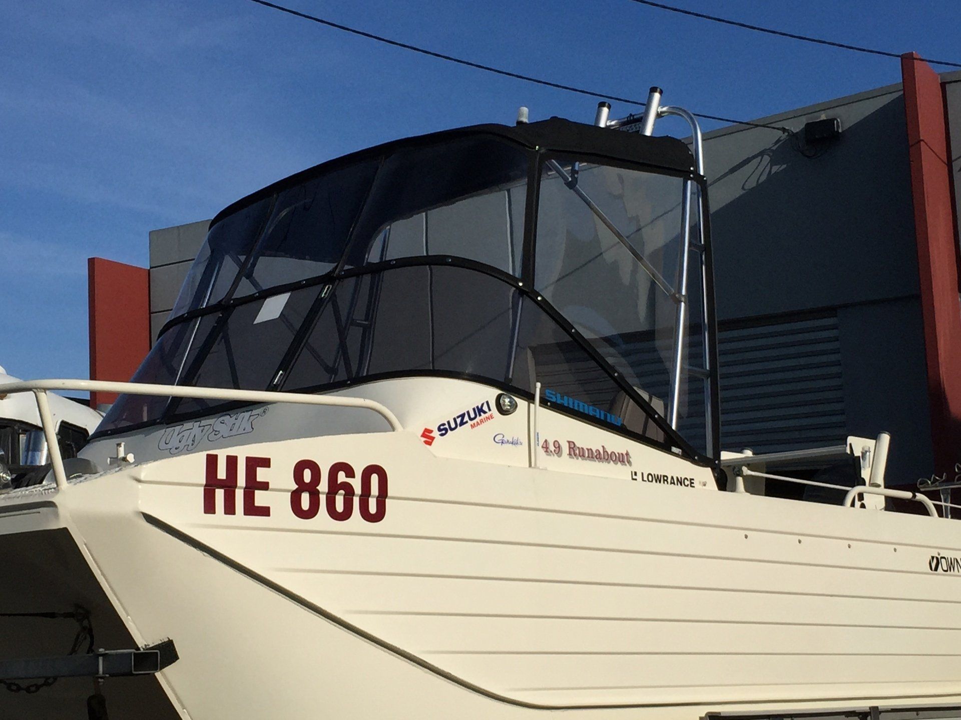Catamaran fishing boat roof with storm protection clears