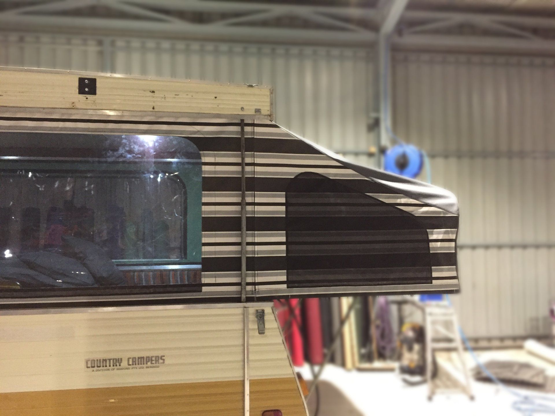 Country Camper  pull out striped canvas caravan bed ends