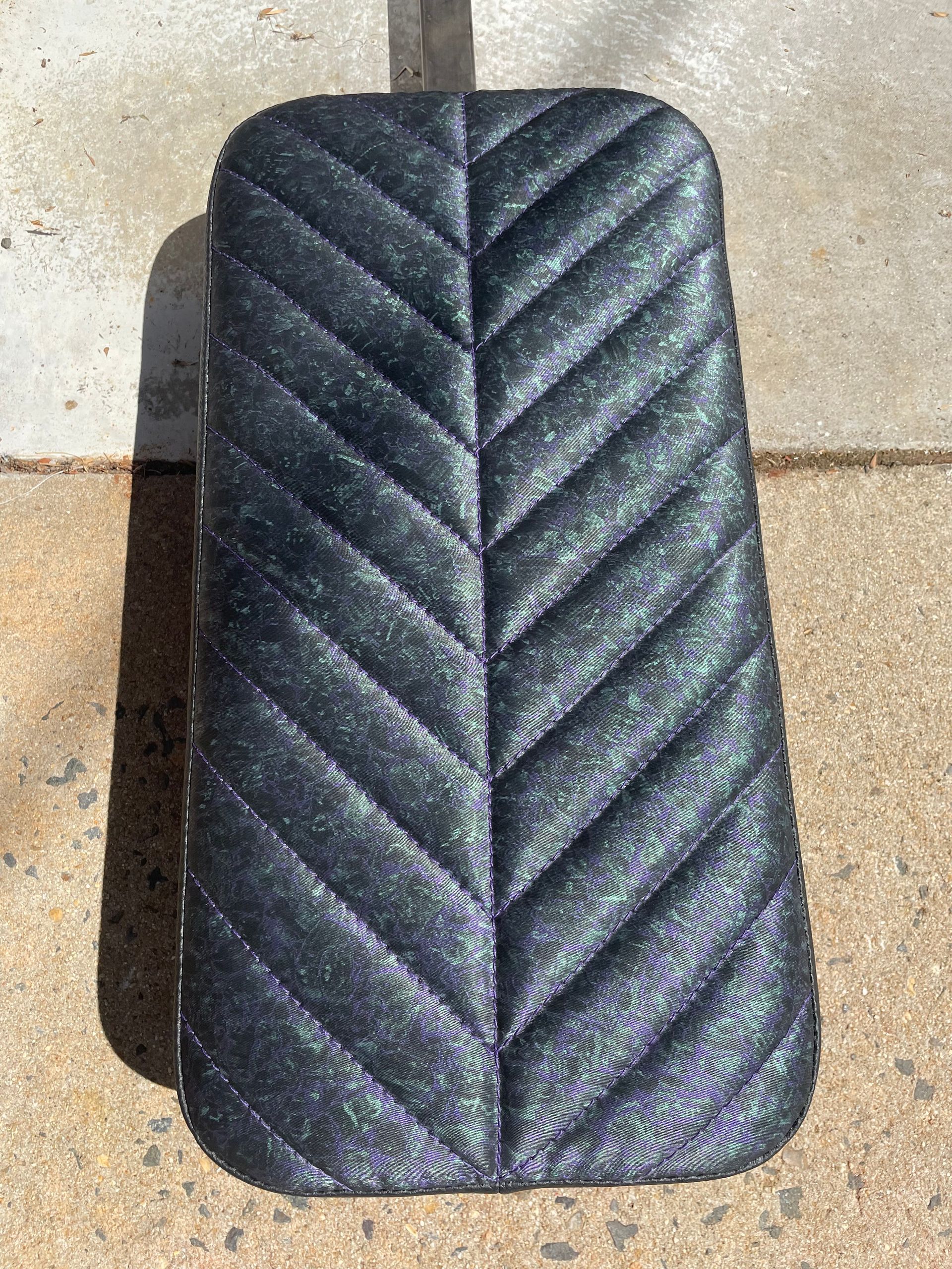 Custom designed padded cushion with designer vinyl and arrow stitching pattern