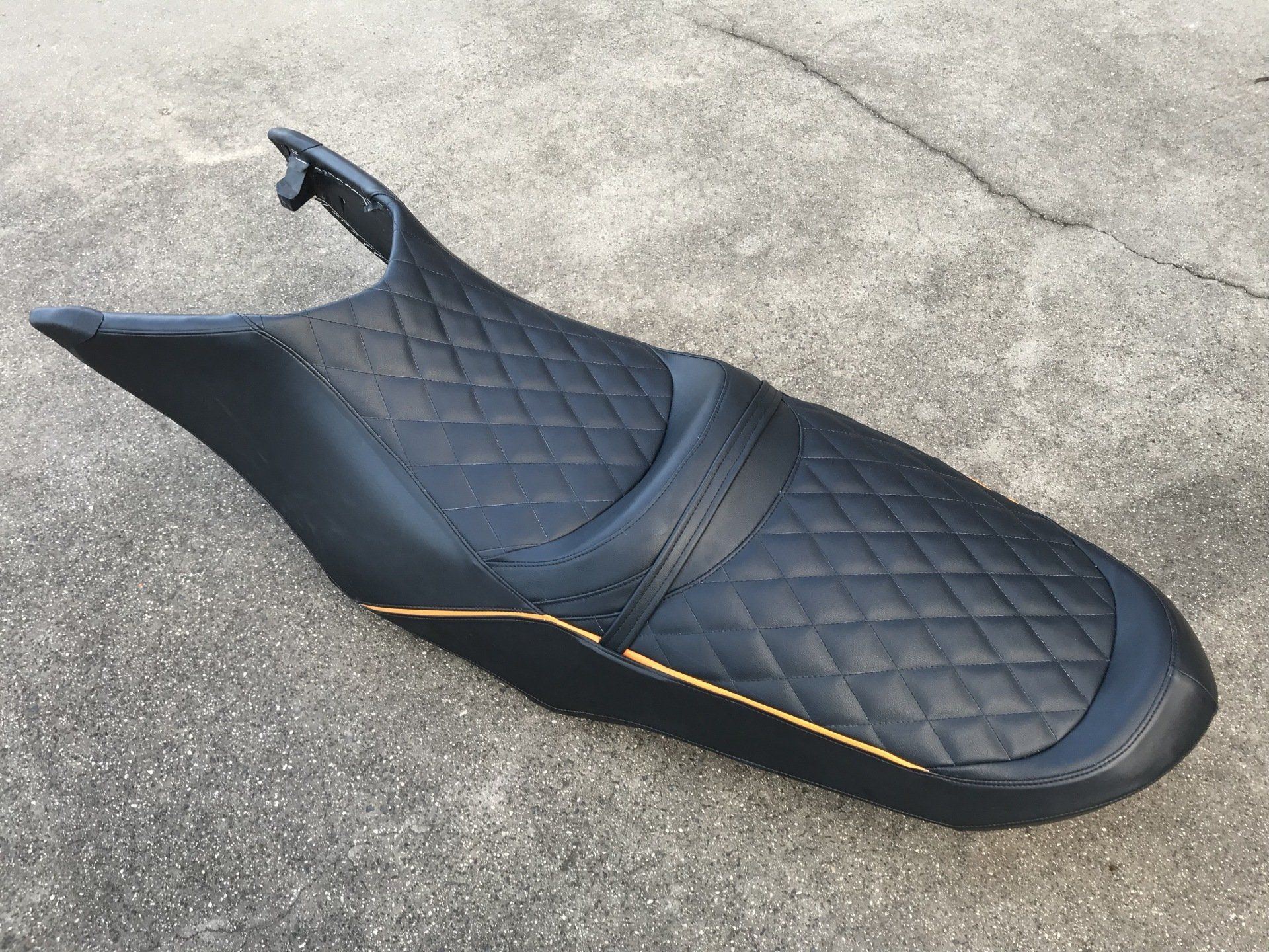 Jet ski seat with orange piping cross stitch