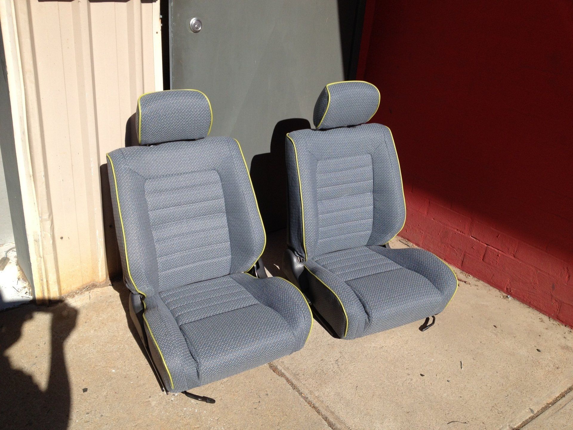 Grey cloth seat with yellow trim