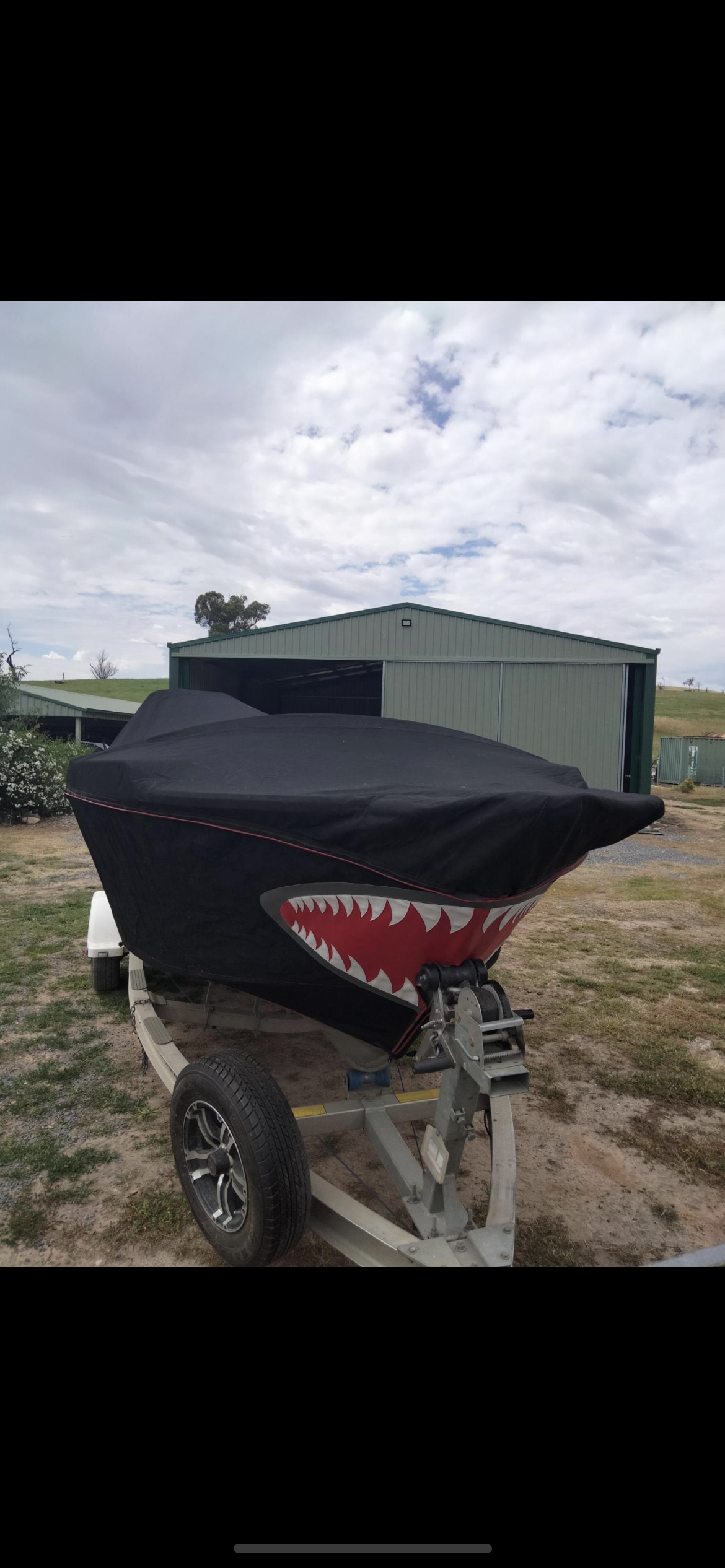 Hand cut and sewn jaws design on boat bag cover - on boat